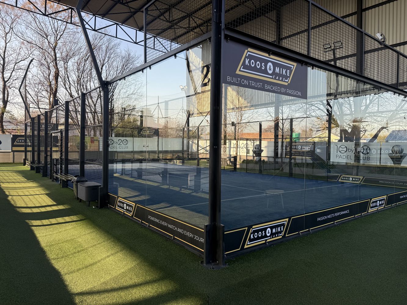 Covered padel court at 10by20 Three Rivers with Koos and Mike branding